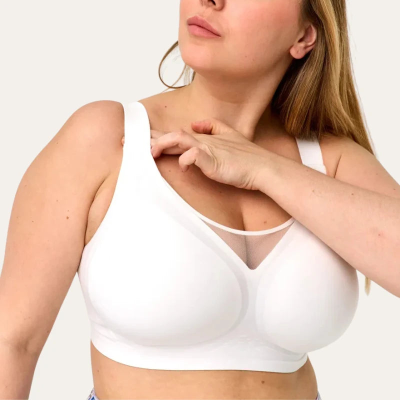 Detalhe frontal do Soutien Nabel branco, com recorte em tela no decote e superfície lisa, sem costuras aparentes