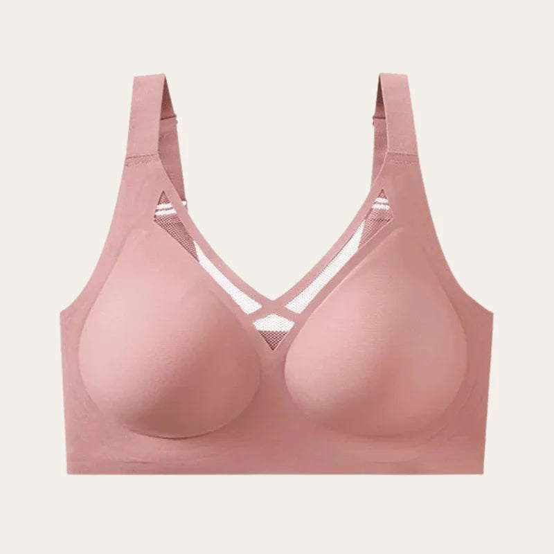 Soutien Sávia Blush sem aro e sem costura em fundo neutro, com recorte em tela no centro, vista frontal